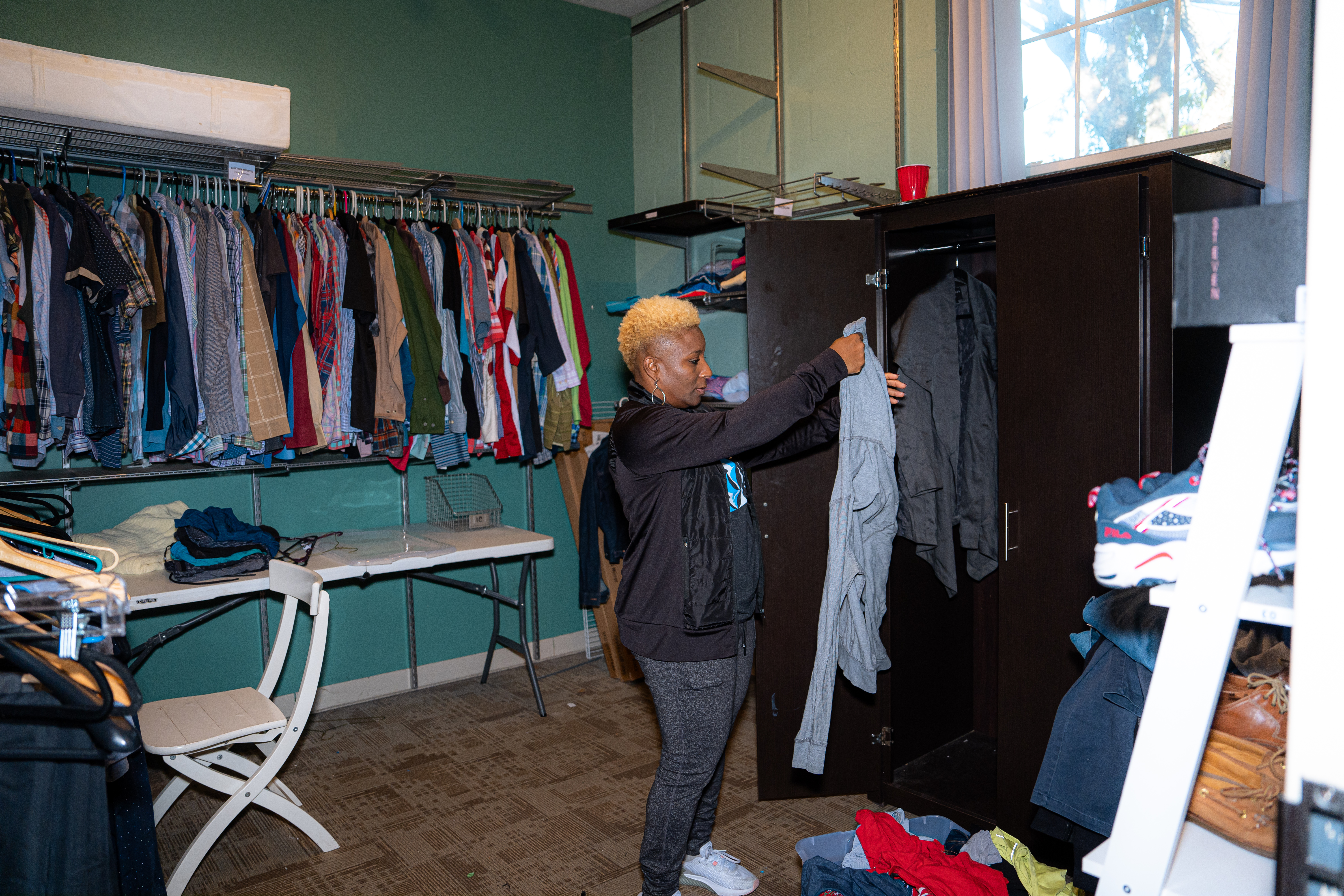 SCANA employee sorting clothing