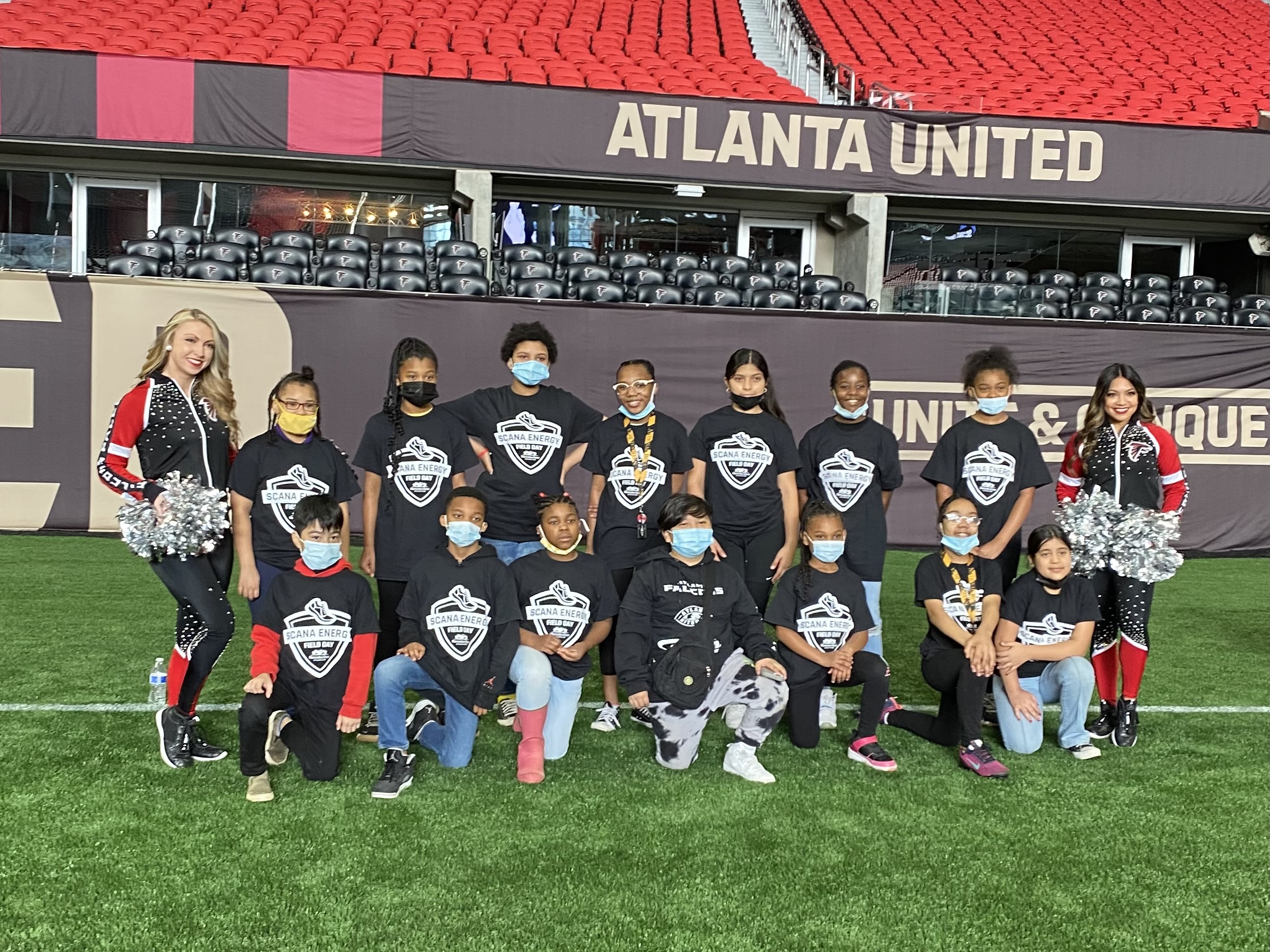 Homework center students with cheerleaders at Mercedes Benz Stadium